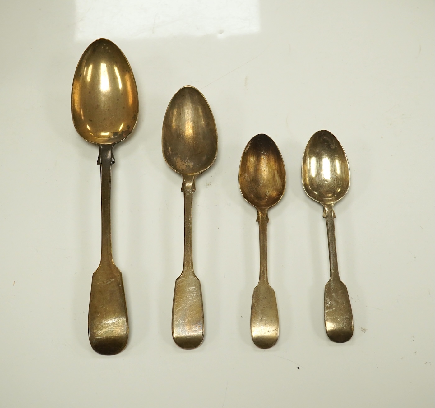 A Victorian harlequin part canteen of silver fiddle pattern flatware, various date and makers, 46.1oz. Condition - poor